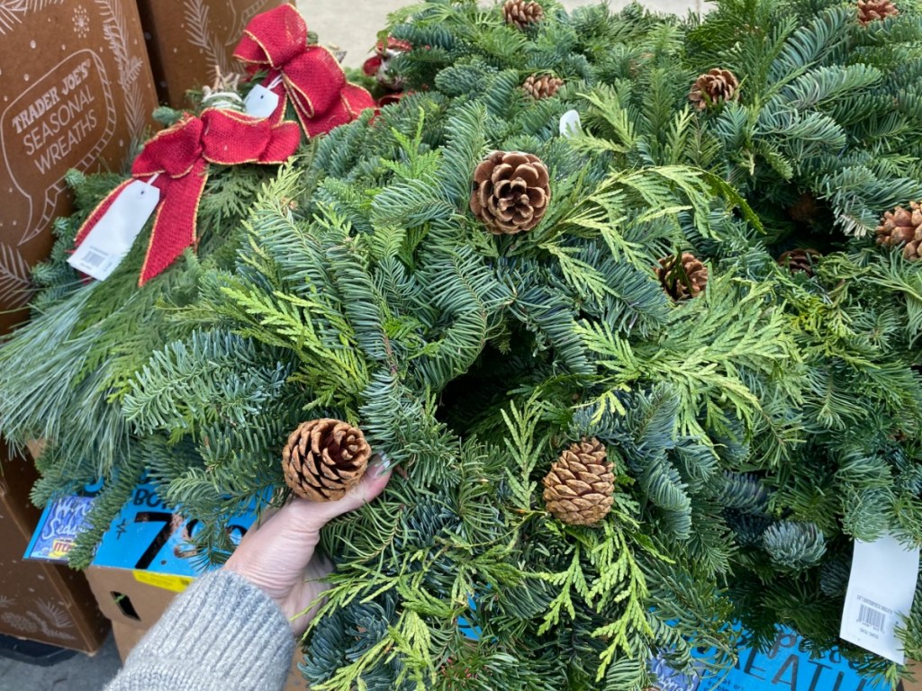 hand holding pine centerpiece