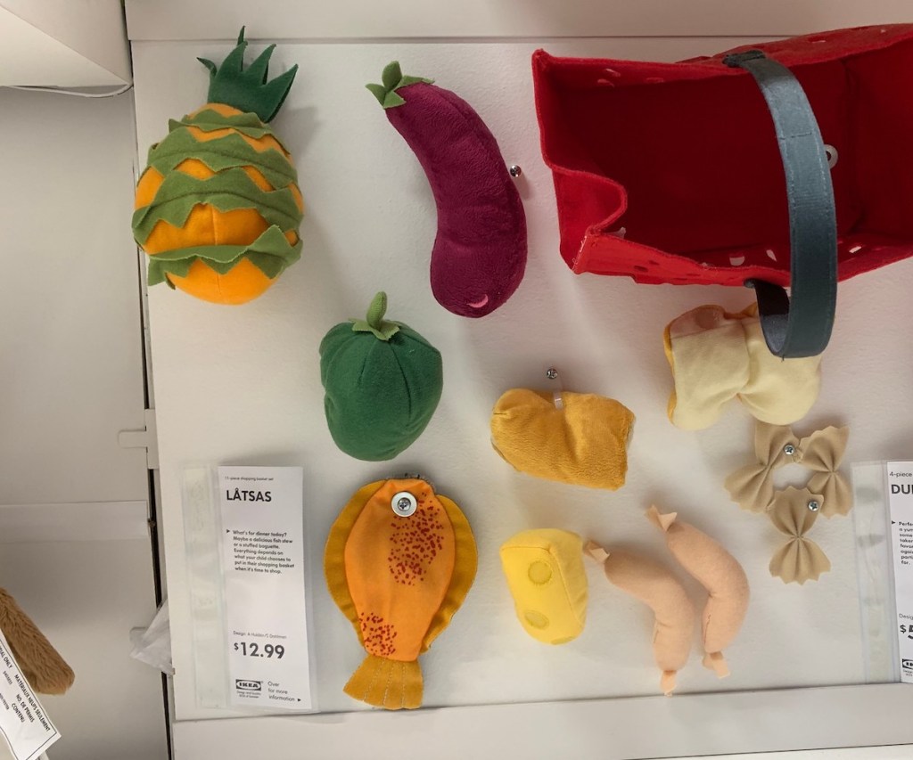 various felt food and red basket sitting on IKEA shelf