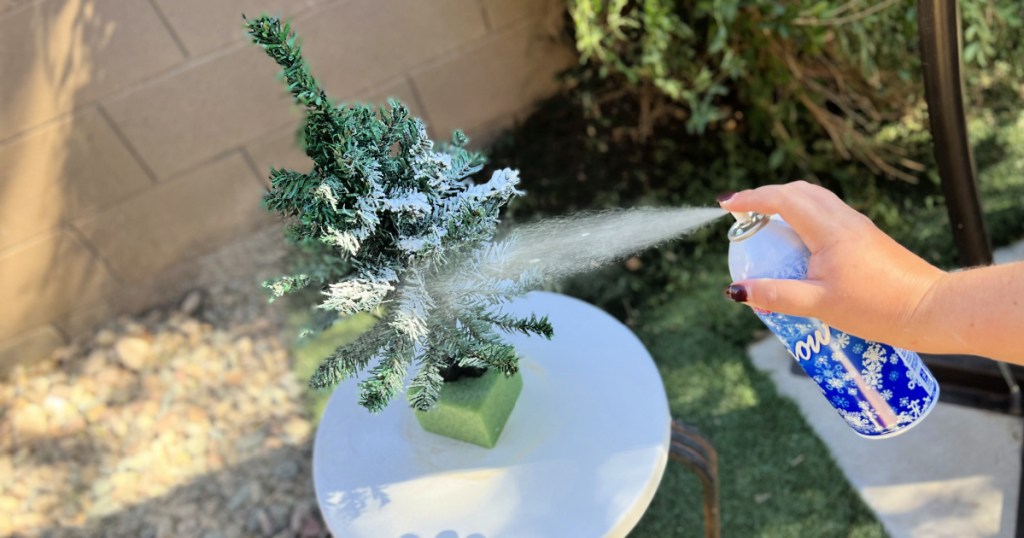 flocking a mini christmas tree with spray