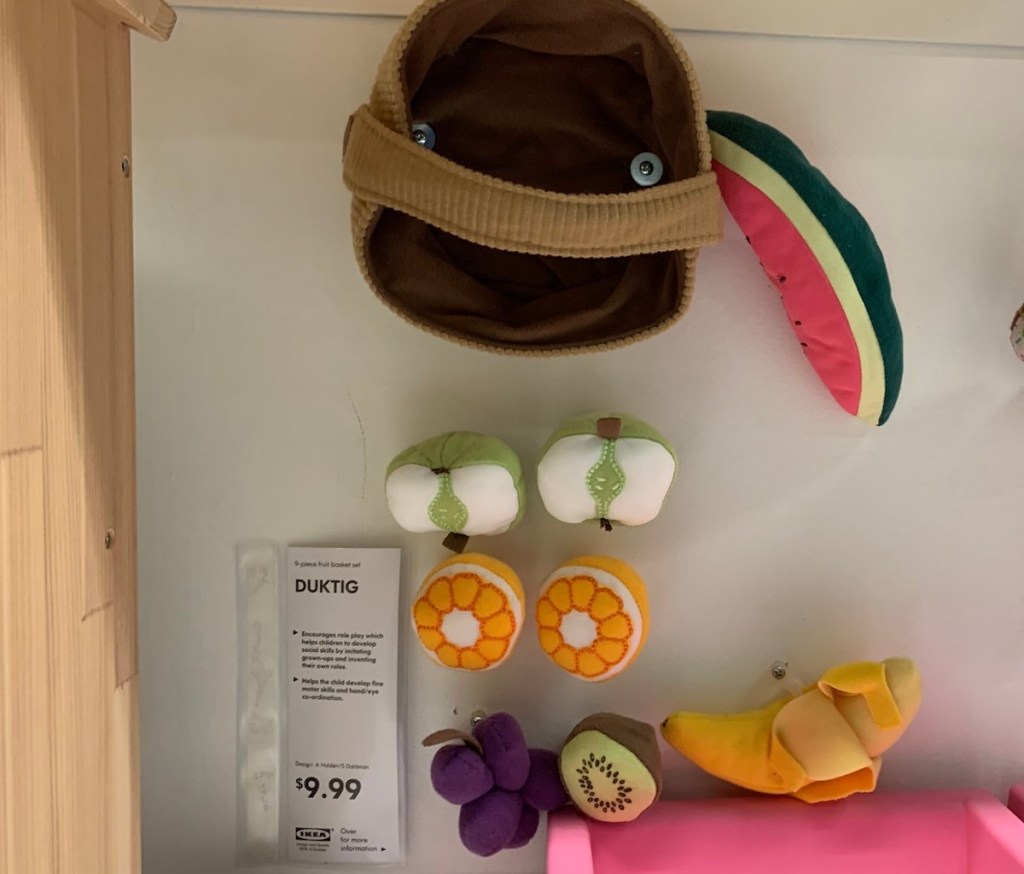 various felt food and red basket sitting on IKEA shelf