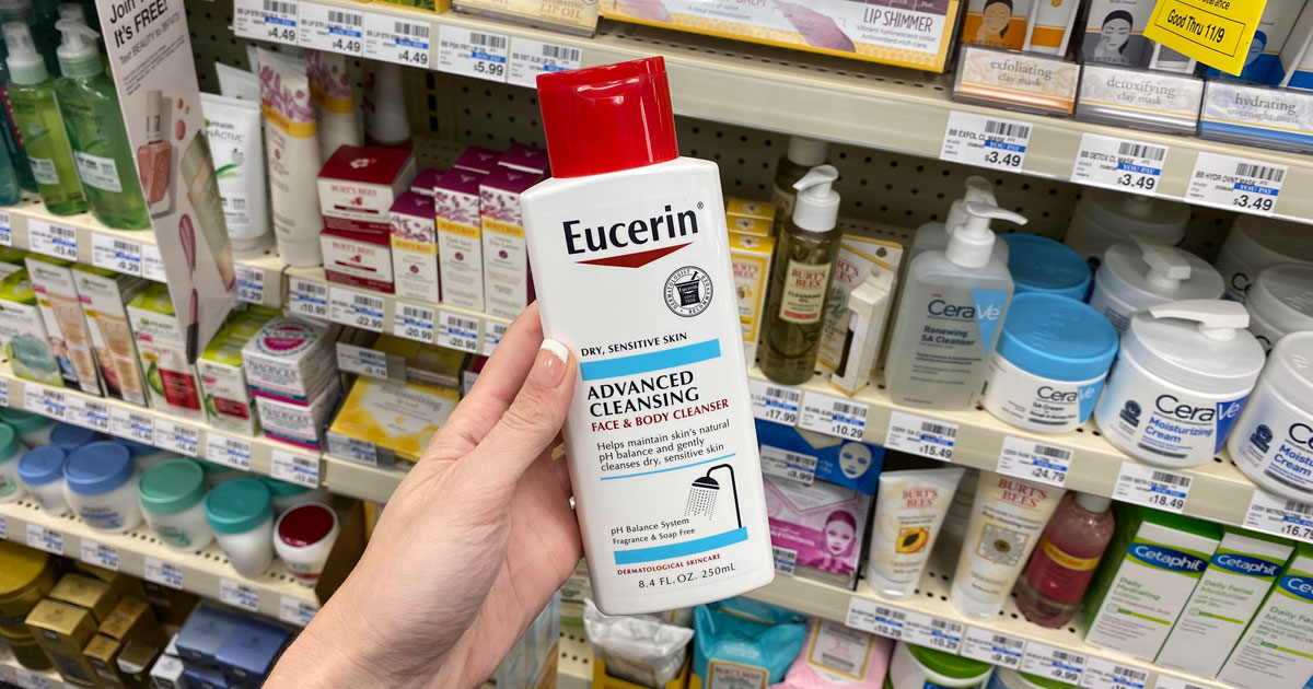 hand holding Eucerin body lotion bottle at cvs