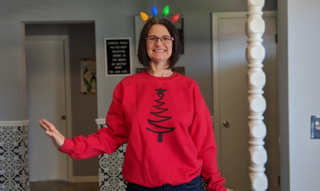 woman wearing red Christmas sweatshirt