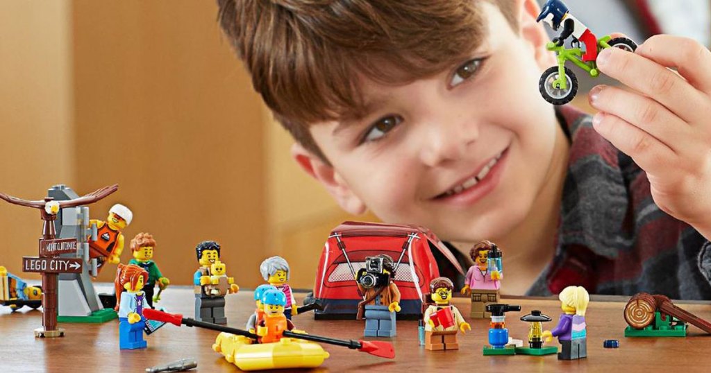 boy playing with LEGO City People Pack Outdoors Adventures Building Kit