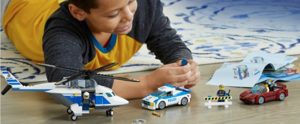 kid playing with lego set