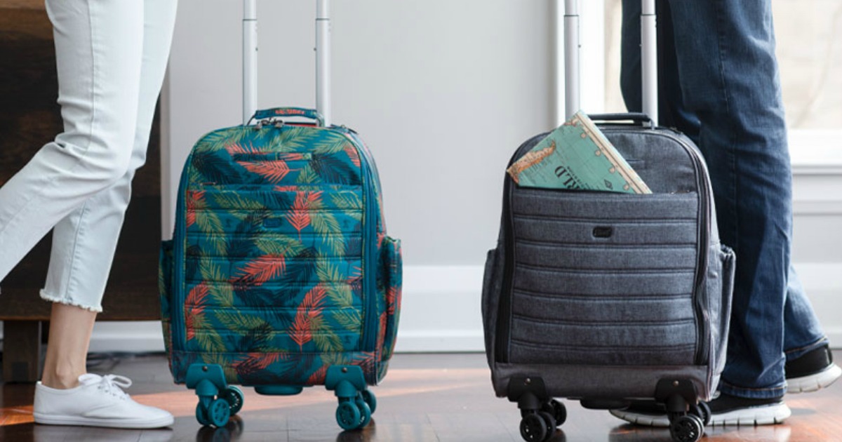 people standing next to spinner luggage bags