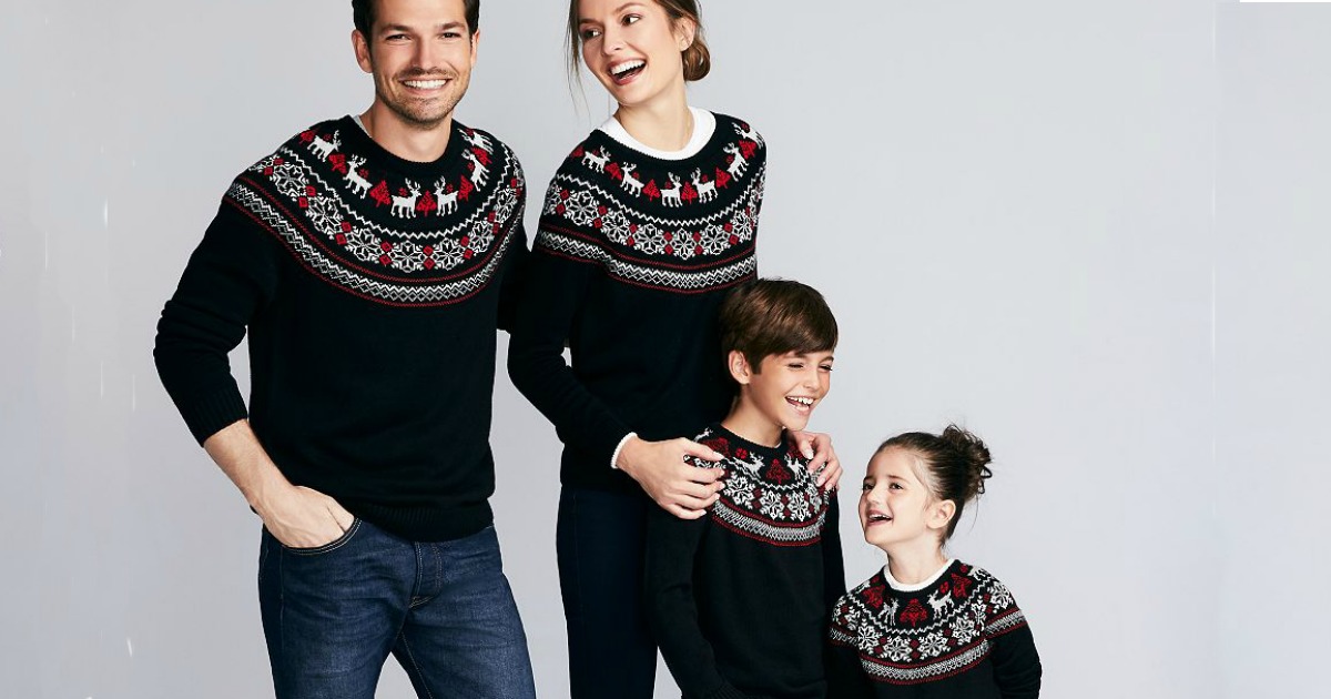 family wearing matching sweaters