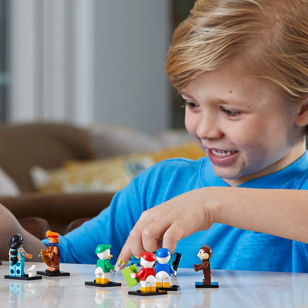 boy playing with disney minifigures