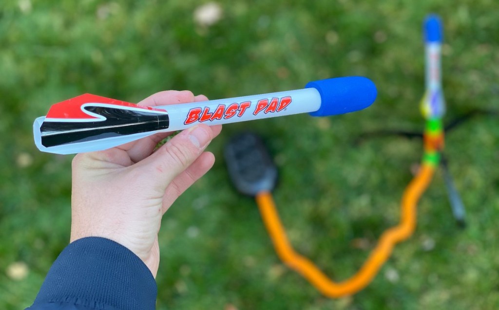 hand holding a foam blast pad rocket launcher