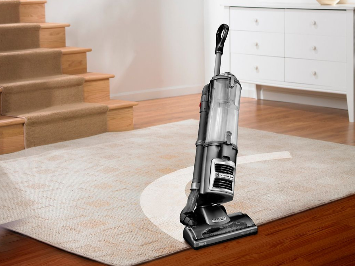 shark vacuum vacuuming a carpet