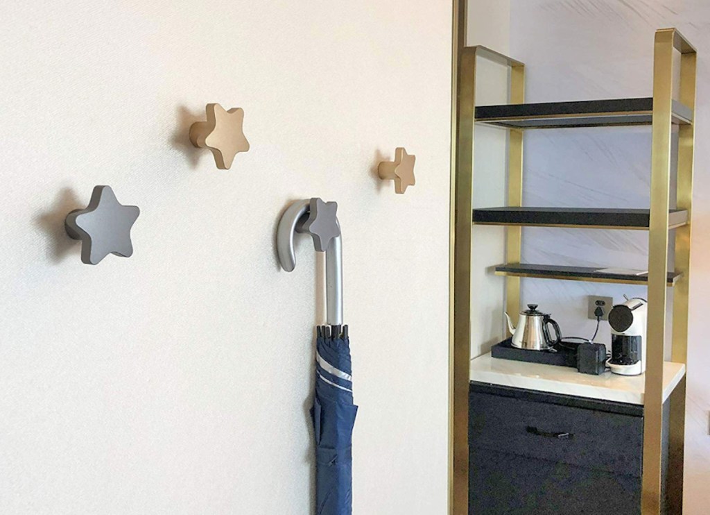 star shaped metal silver and gold wall knobs hooks on wall