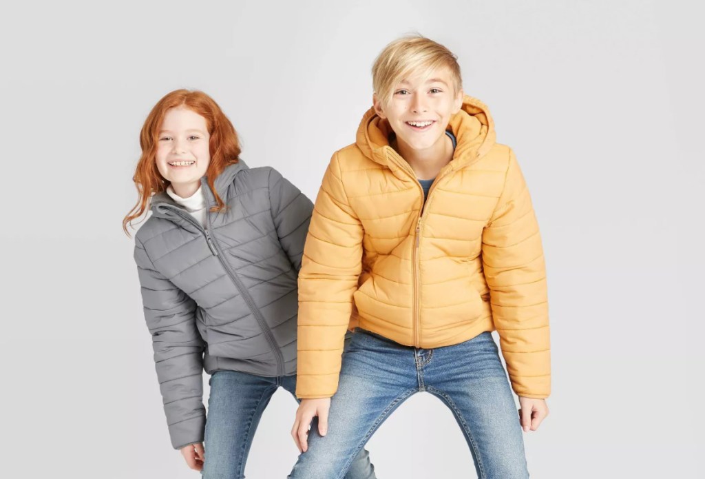 2 kids wearing puffer jackets