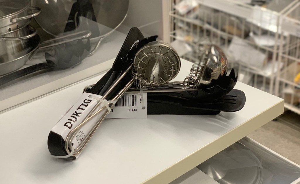 stainless steel utensils set on white counter