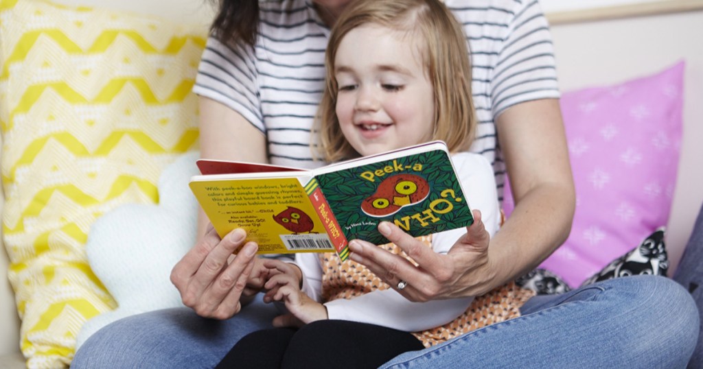 Woman and little girl reading Peek-A-Who board book 