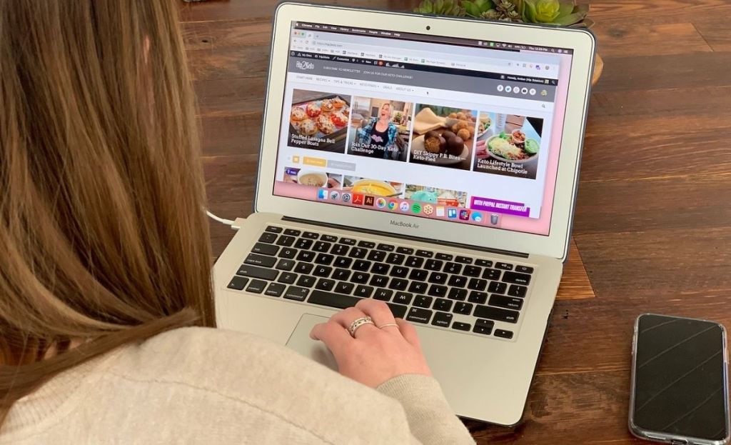 A person with a laptop at a table