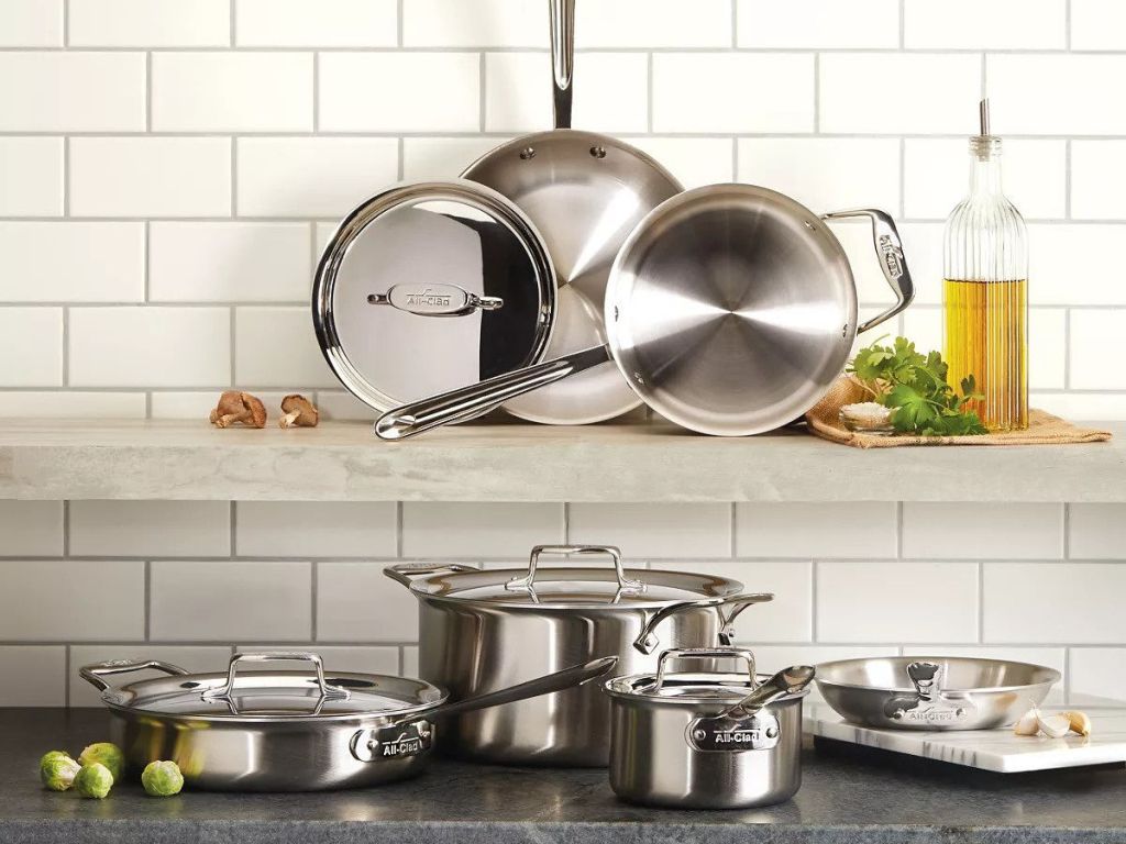 All-Clad D5 Stainless Brushed 10-Piece Cookware Set on shelf and counter top in kitchen