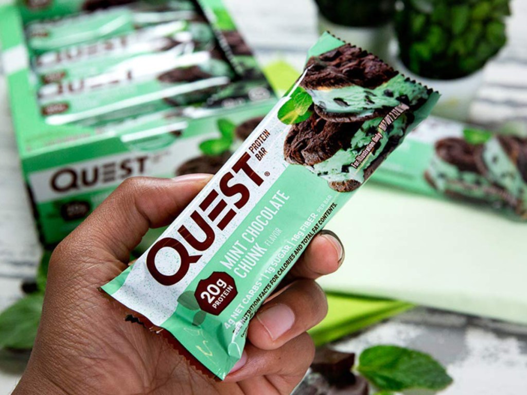 Hand holding Quest Mint Chocolate Chunk Protein Bars