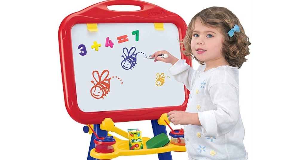 girl playing with Crayola dry erase board and chalk board