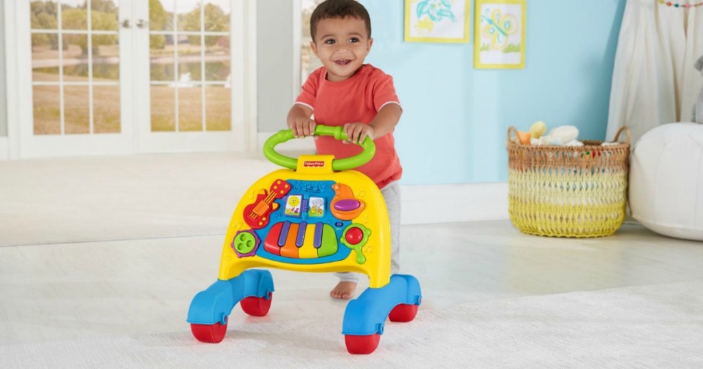 boy pushing Fisher-Price Walker