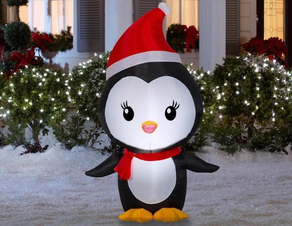 Gemmy Lighted Penguin Christmas Inflatable in snowy yard