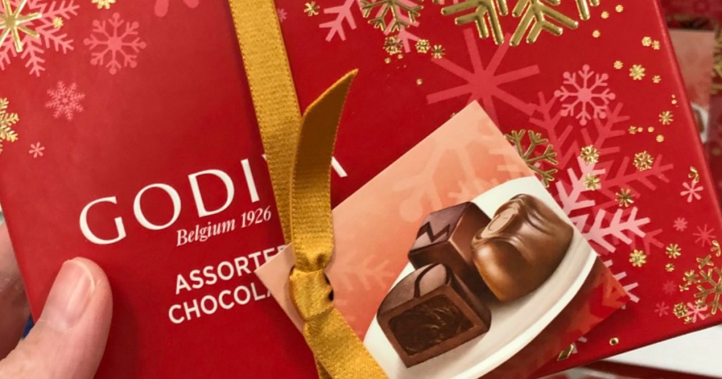 hand holding Godiva Gift Box