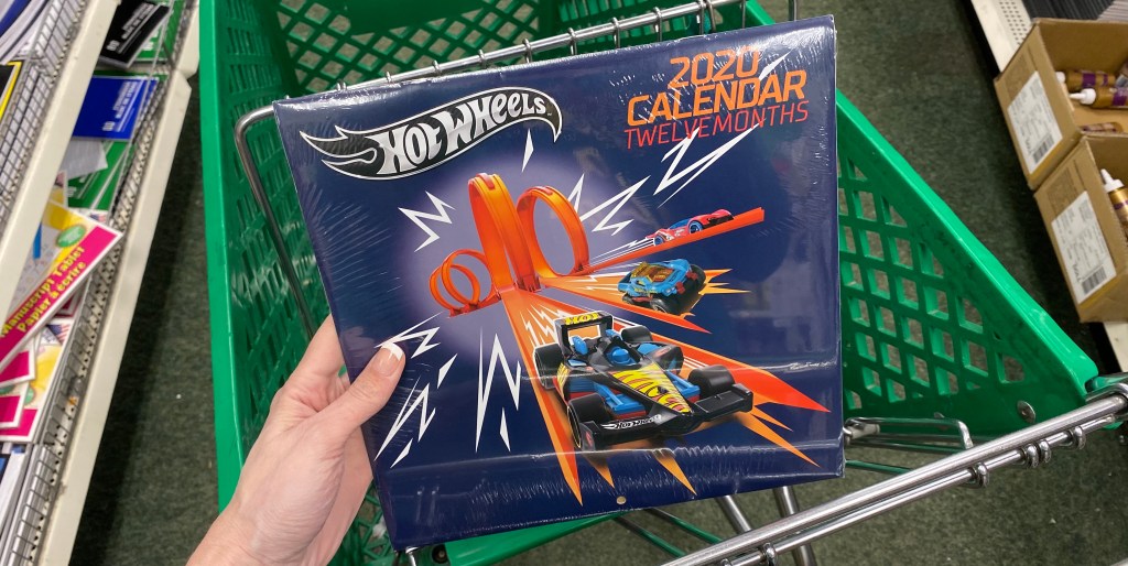 hand holding a Hot Wheels Calendar in a cart