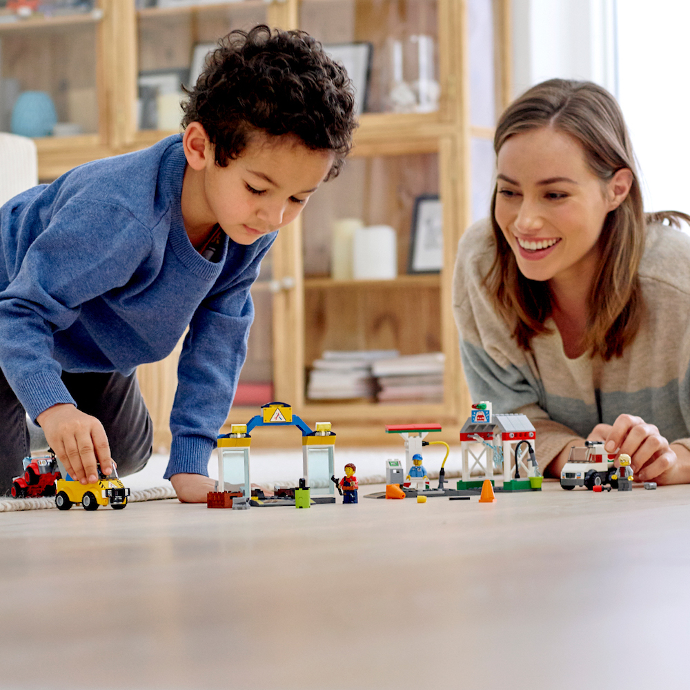 Mom and son playing with Lego Garage Center