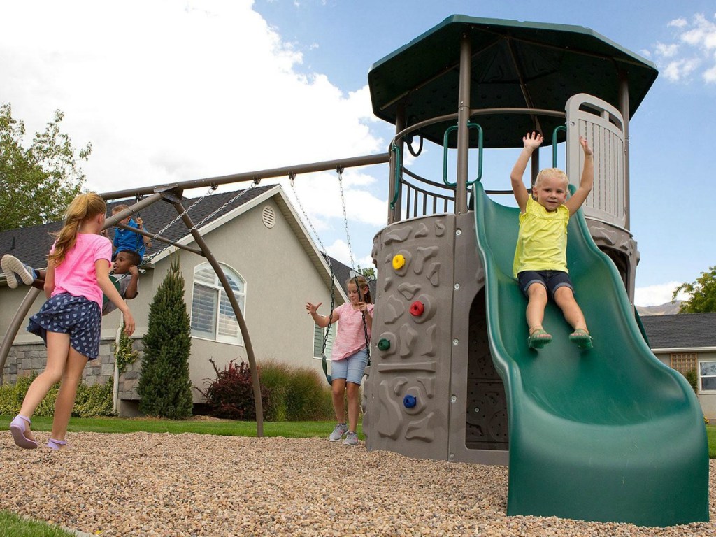 Kids playing on a backyard playset from Sam's Club