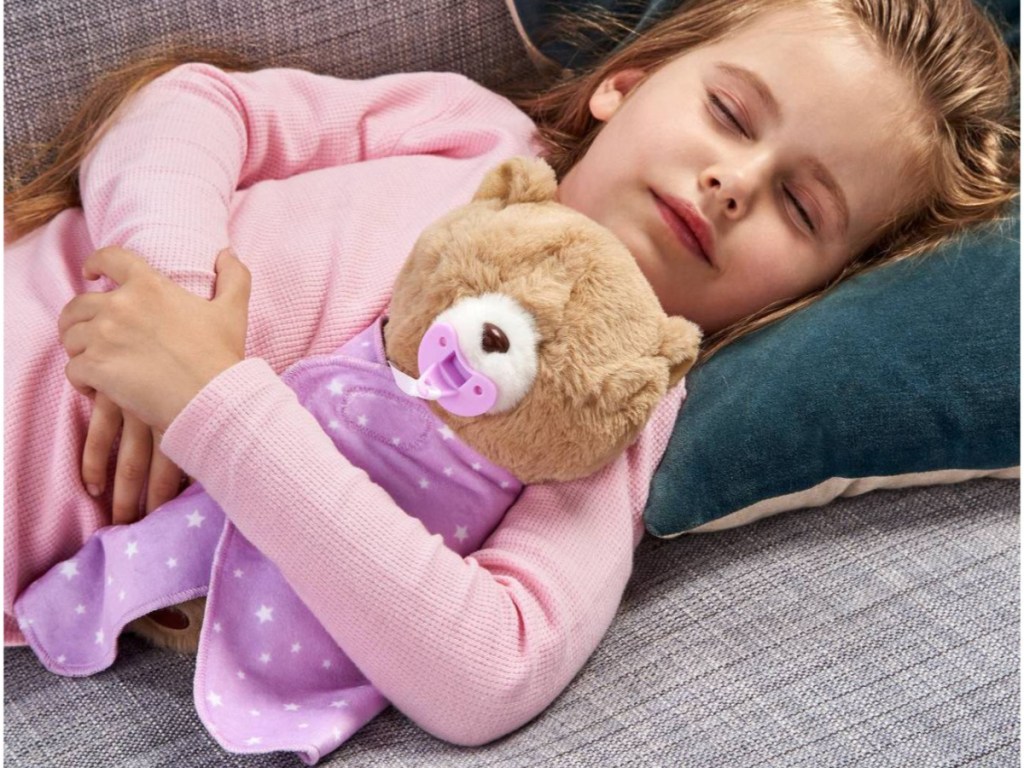 little girl sleeping with teddy bear