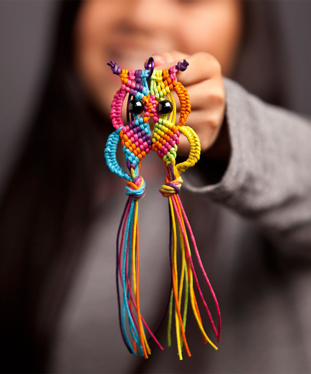 girl holding Macrame Owl Charm