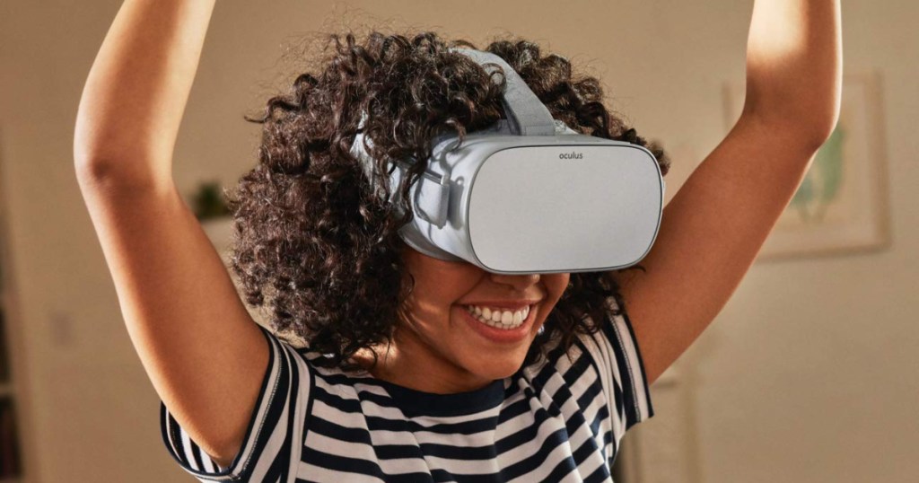 girl wearing Oculus Go Virtual Reality Headset on face in the room