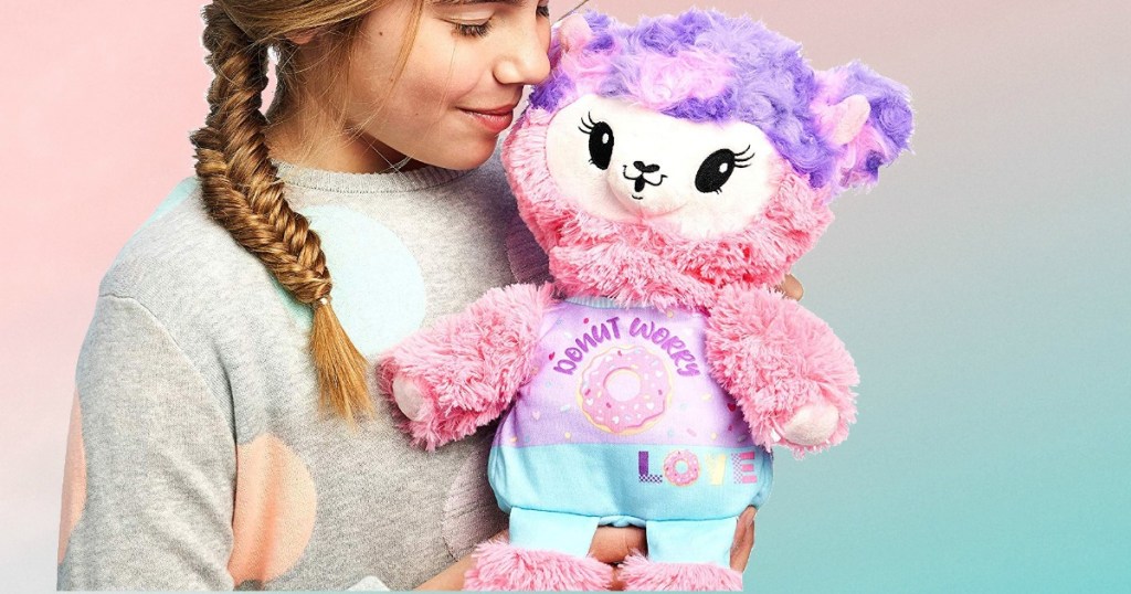 Girl holding a Pikmi Pop Plush llama