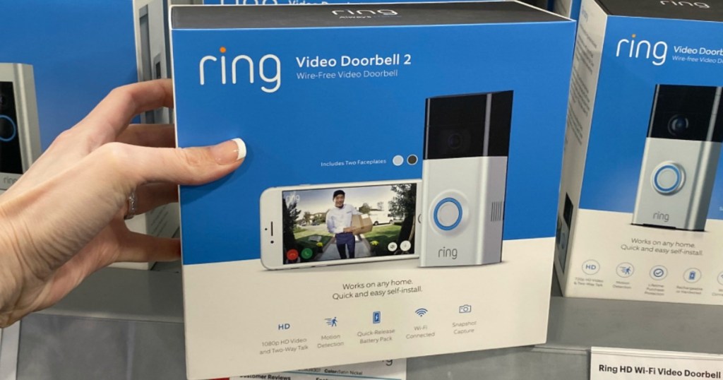 hand holding box of a Ring Video Doorbell 2