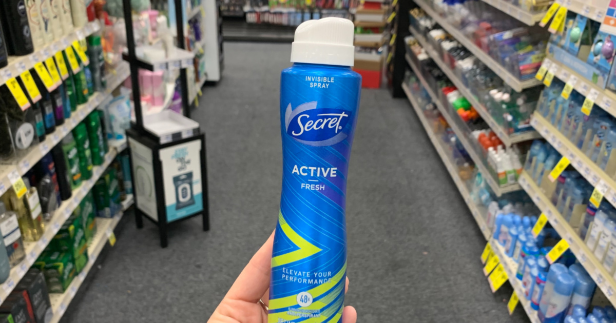 Hand holding Secret deodorant 