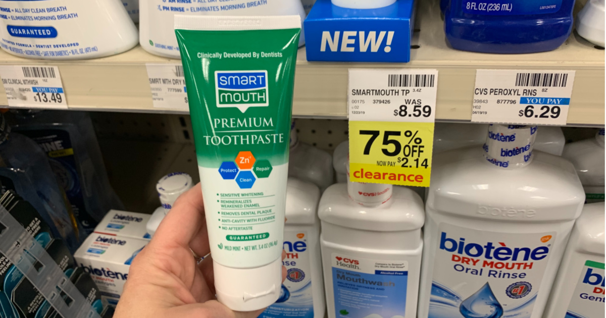 Smart Mouth toothpaste in front of shelf 