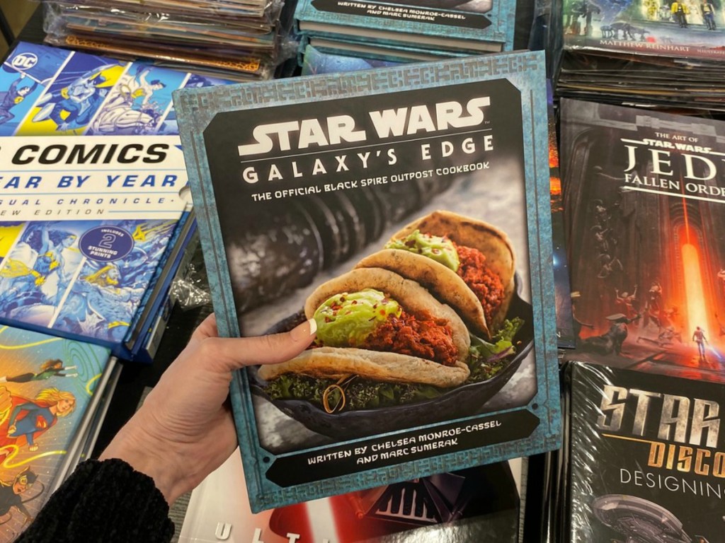 Star Wars Cookbok in hand on display in store