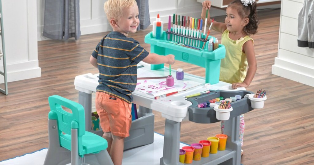 kids playing with Step2 Art Desk