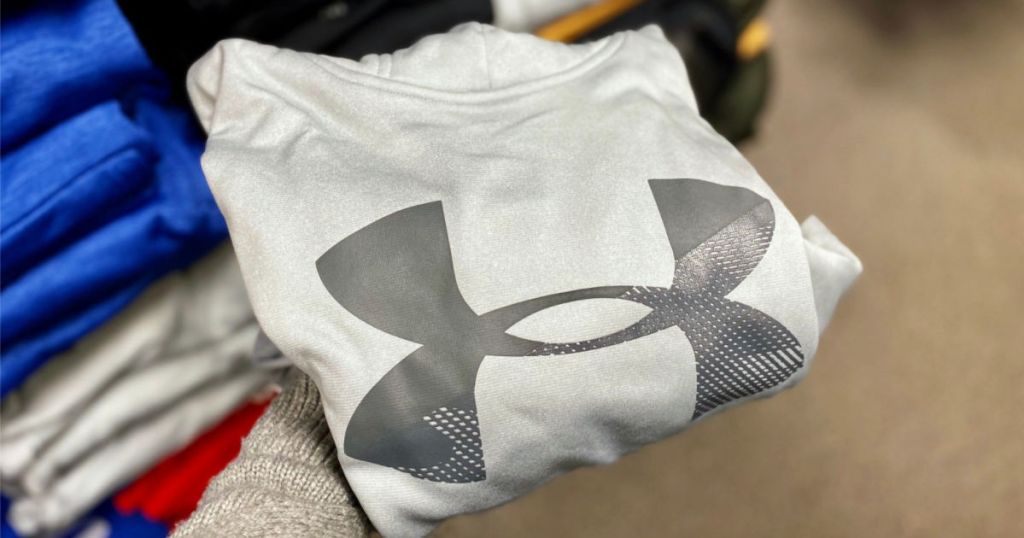 hand holding Under Armour Sweatshirt in grey