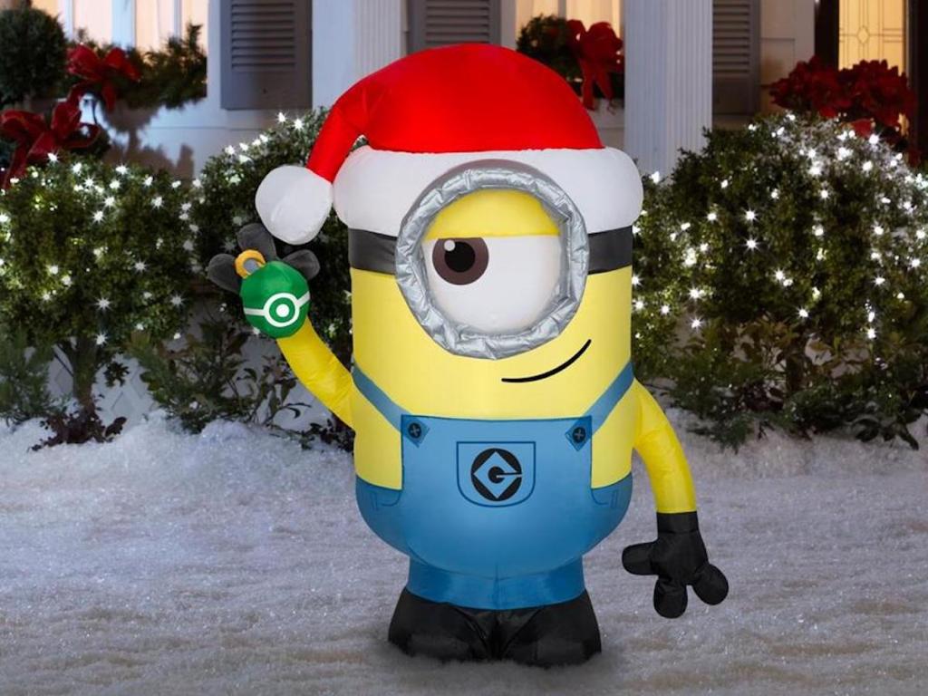 Universal Lighted Minion Christmas Inflatable in snowy yard