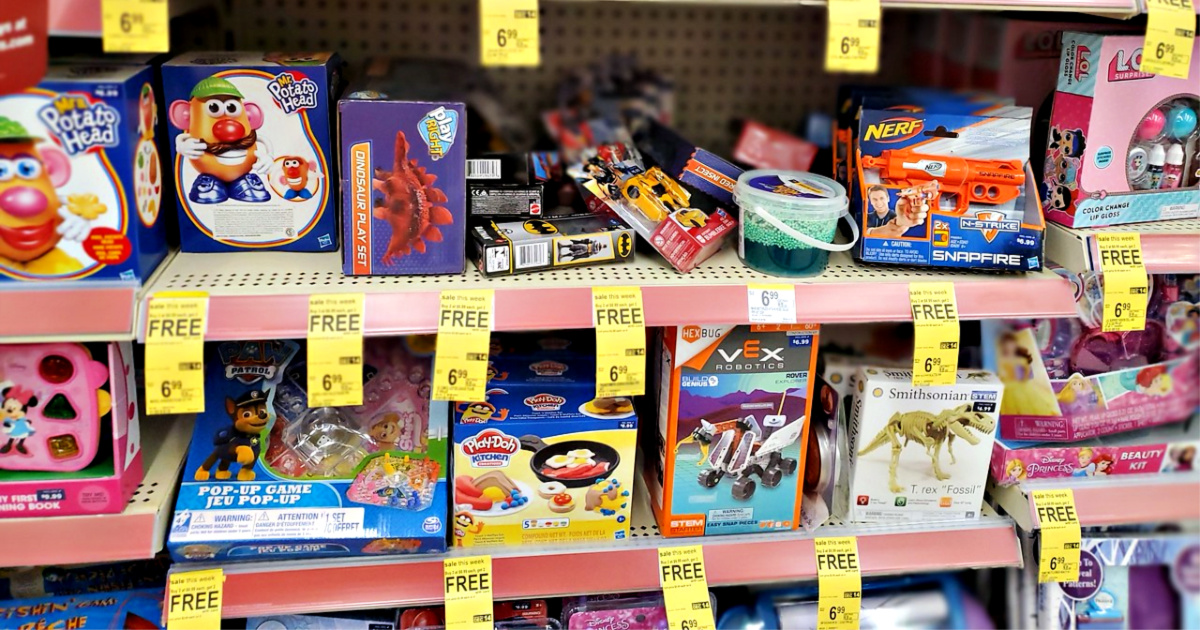 boxes of toys and sale tags on Walgreens store shelf