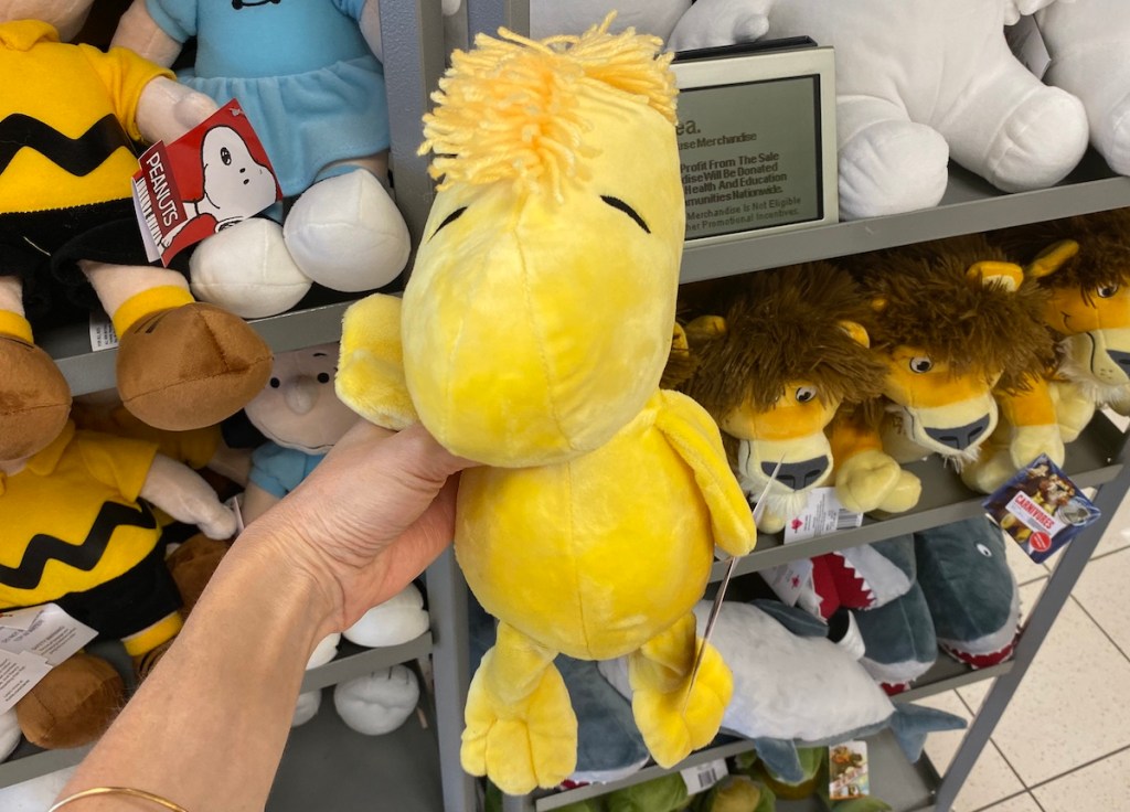 hand holding a Woodstock Plush