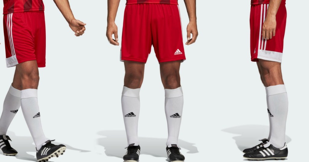 man wearing adidas shorts, shoes and socks