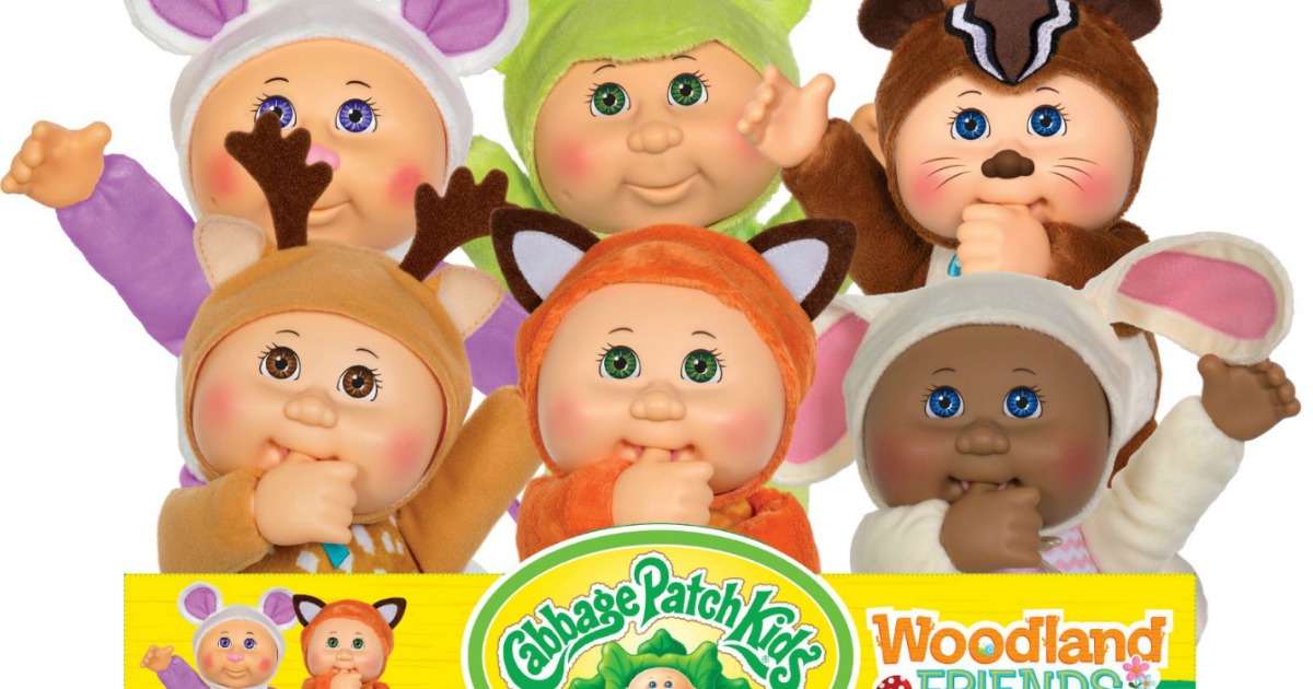 stock image of Cabbage Patch dolls in woodland outfits