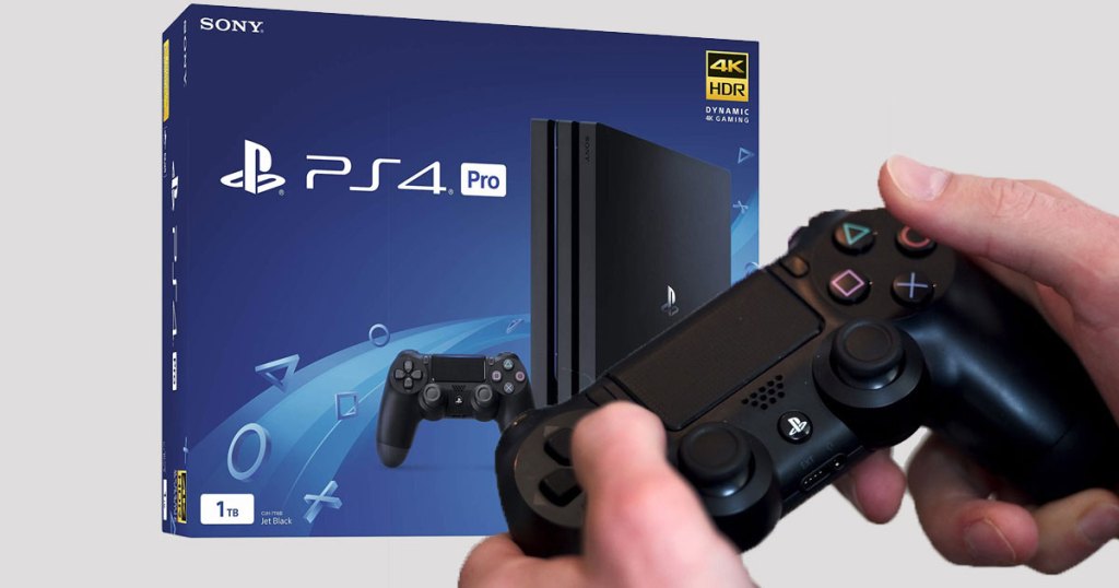 guy holding controller and box of PS4 Pro 1TB