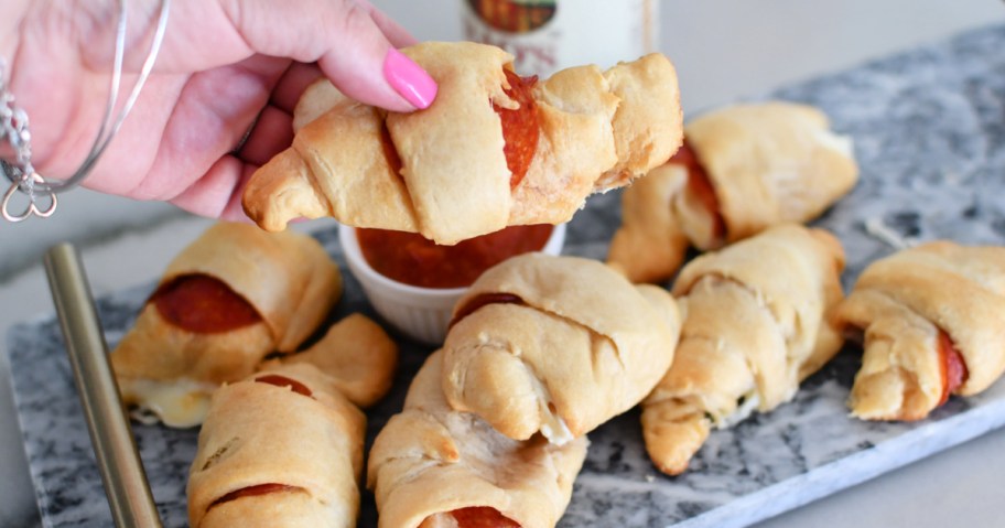 holding a pizza crescent roll