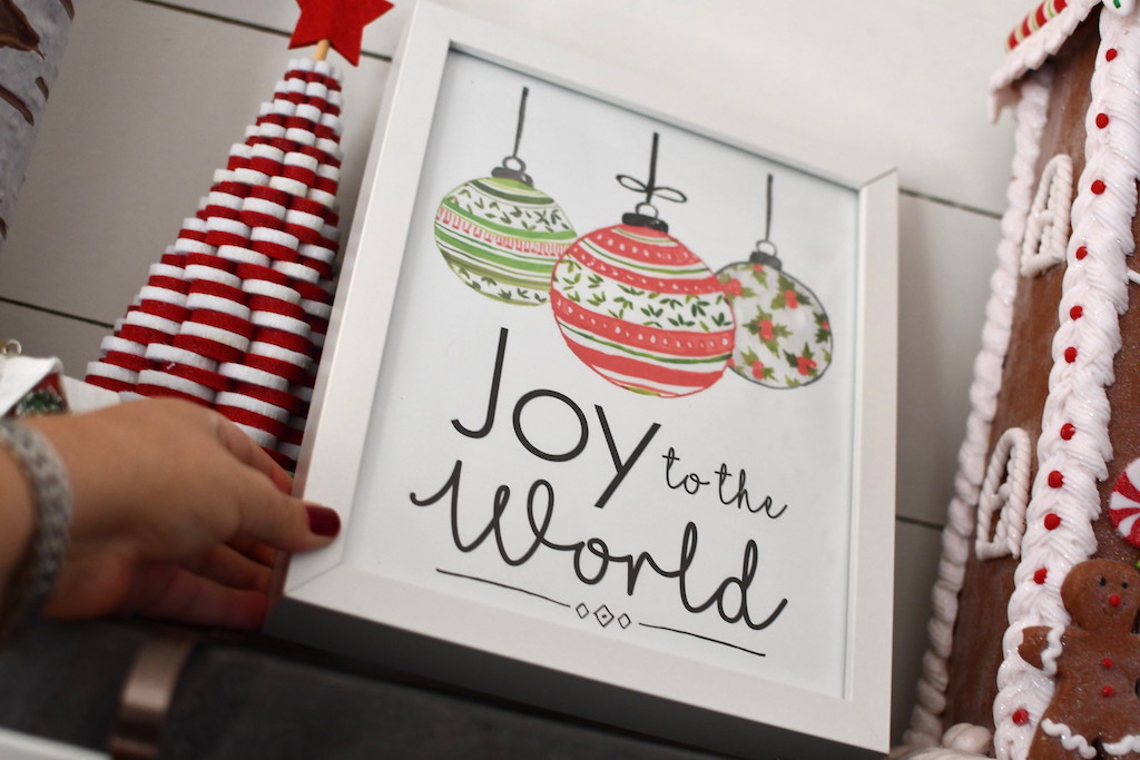 putting joy to the world framed art on shelf 