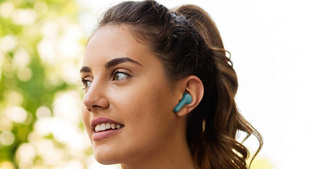 woman wearing jvc gumy earbuds