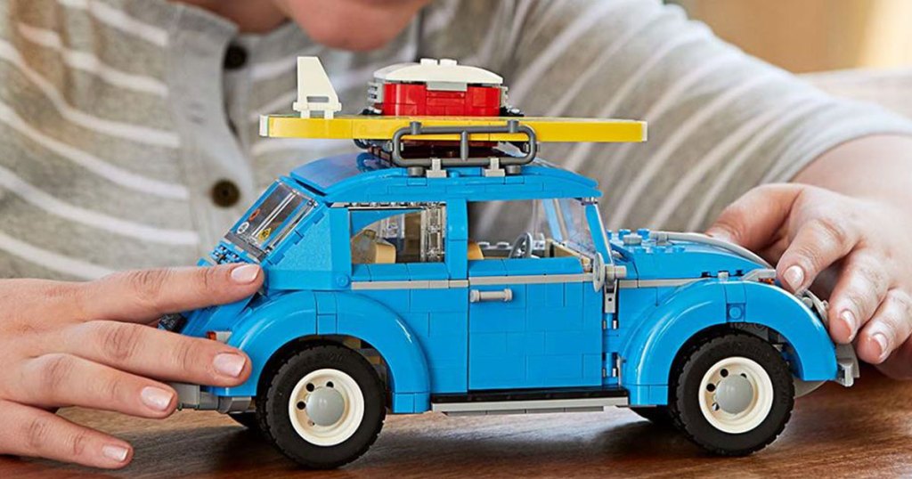 child playing with LEGO Creator Expert Volkswagen Beetle Building Set