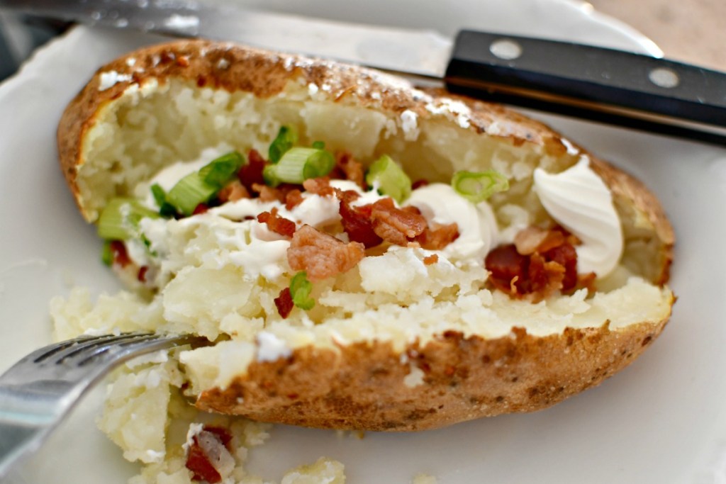 loaded baked potato on a plate