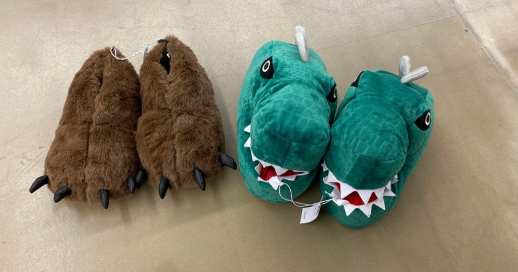 bear and dino slippers on floor