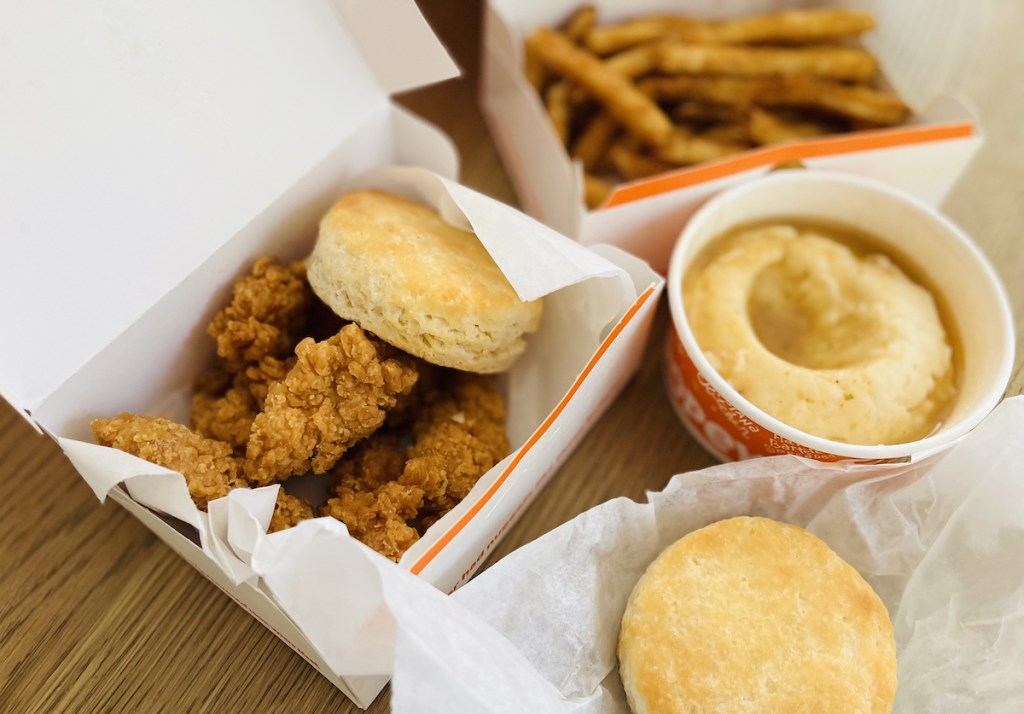 popeyes fried chicken mashed potatoes and biscuits sitting on table